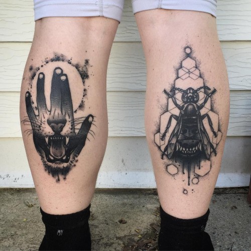 Black ink medium size painted by Michael J Kelly legs tattoo of human hand and bug with lion teeth