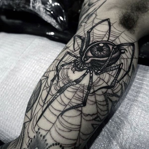 Black ink mystical spider with eye and web tattoo on biceps