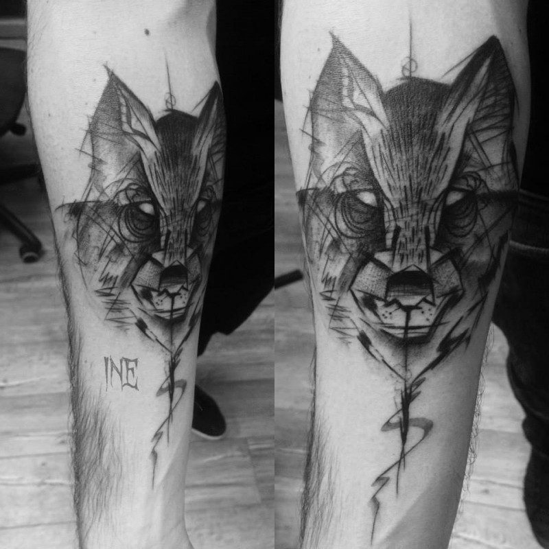 Black ink old looking forearm tattoo of wolf by Inez Janiak with lettering