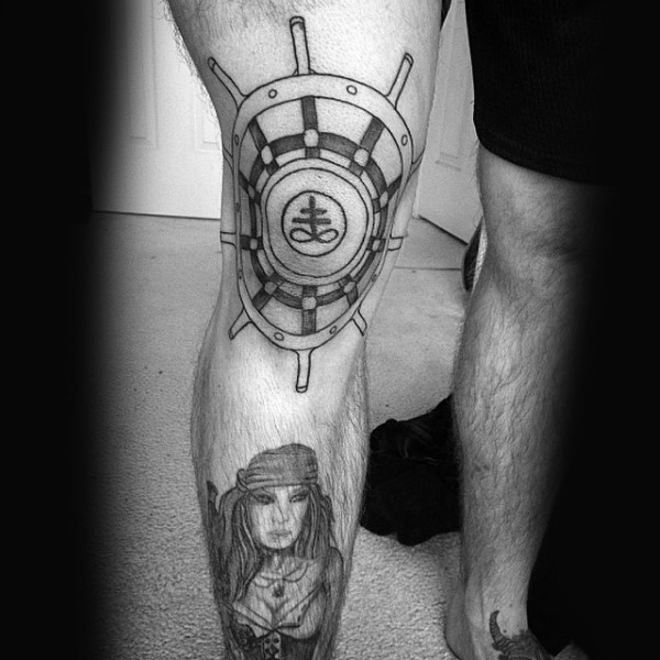 Black ink original designed ships steering wheel tattoo on knee