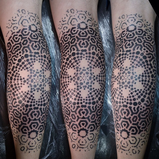Black ink ornamental style leg tattoo of cute flower