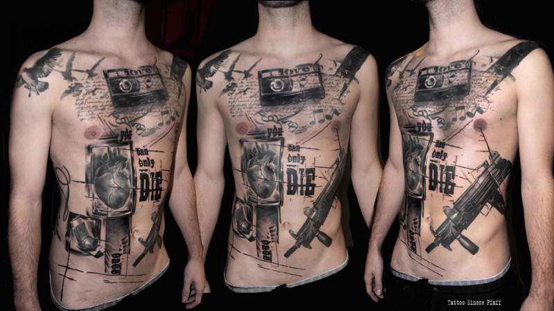Black ink photoshop style chest and belly tattoo of lettering with camera and gun