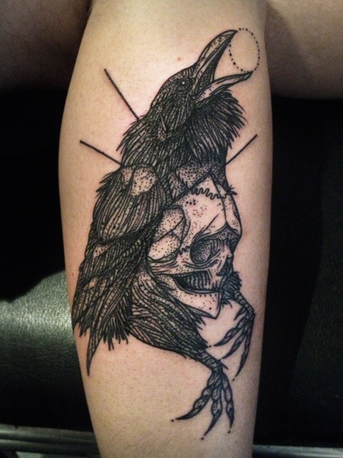Black ink raven with skull tattoo