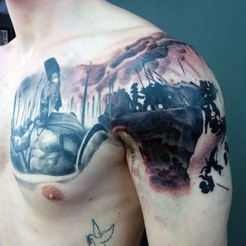 Black ink shoulder and chest tattoo of 300 Spartans movie scene