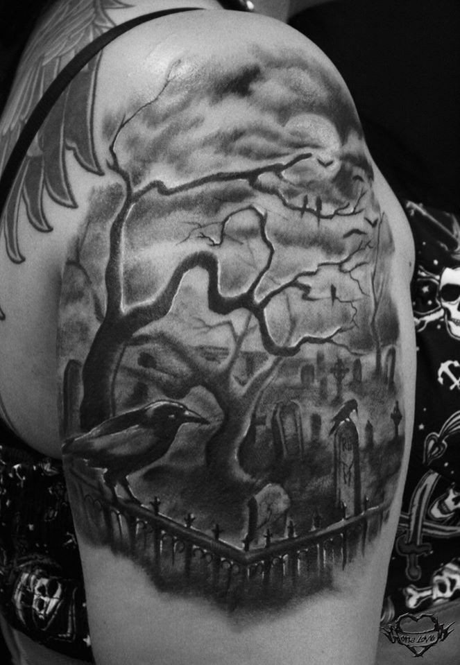 Black ink shoulder tattoo of creepy cemetery with crow