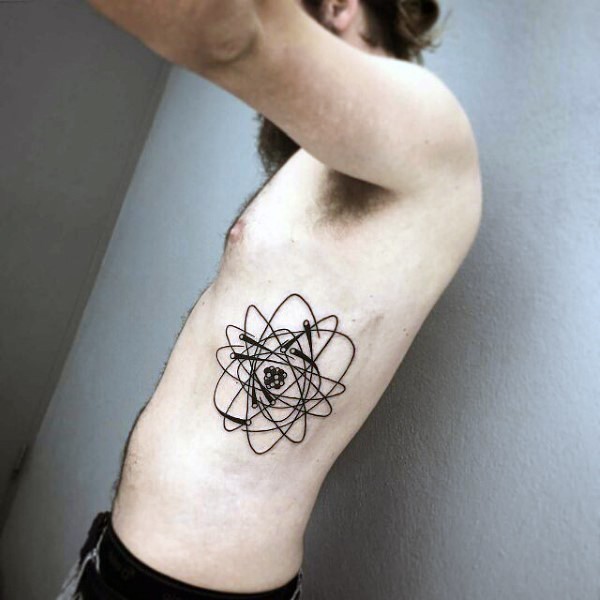 Black ink side tattoo of medium size atom