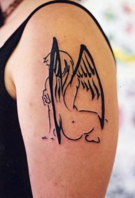 Black ink silhouette angel tattoo on shoulder