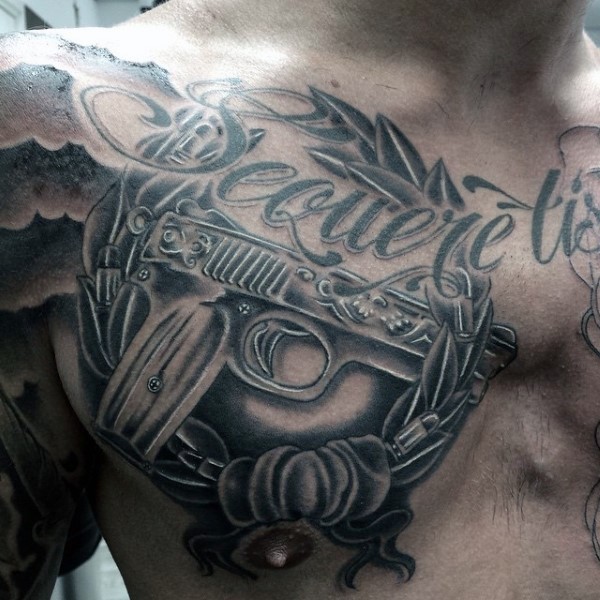 Black ink style interesting looking modern pistol tattoo on chest with lettering