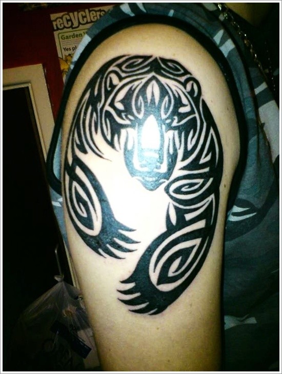 Black ink tribal bear tattoo on half sleeve