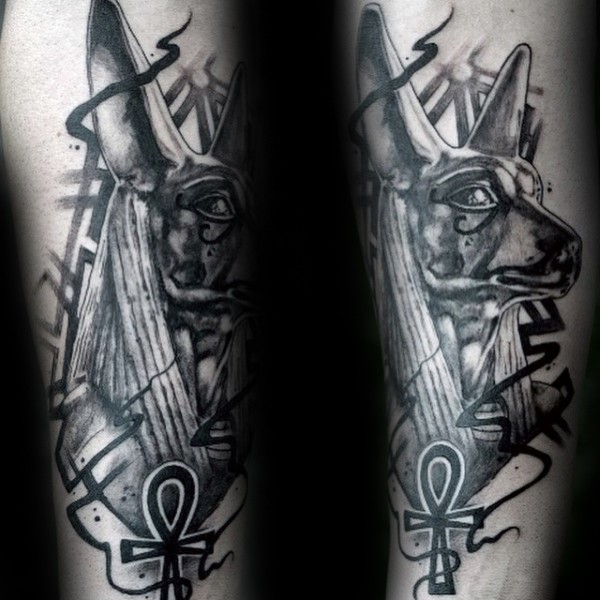Black ink typical arm tattoo of Egypt God with symbols