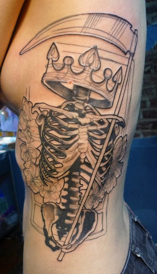 Black ink unfinished large side tattoo of human skeleton with crown and flowers