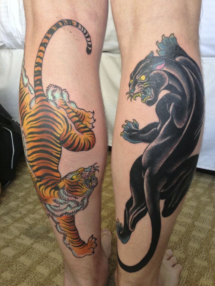 Tatuaggio sulle gambe la pantera nera & la tigre feroce