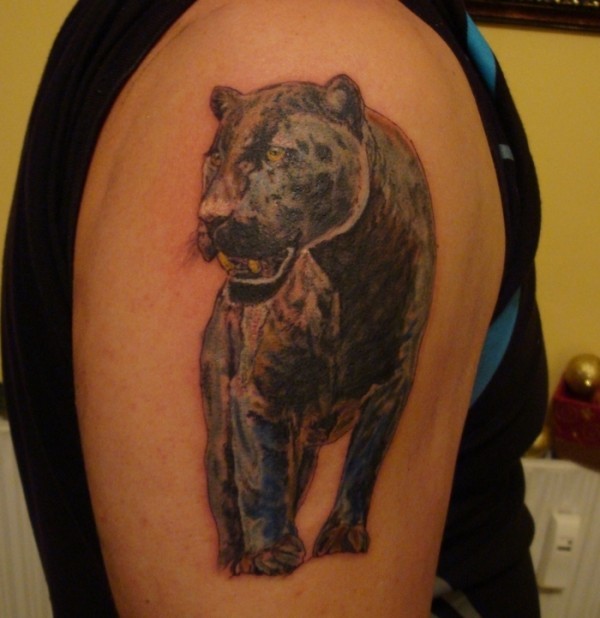 Black panther walking tattoo on shoulder