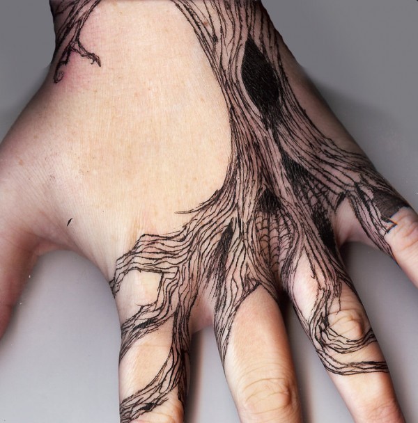 Black tree tattoo on wrist