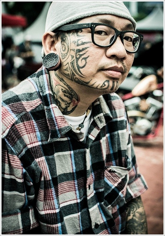 Black tribal face tattoo