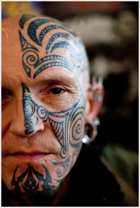 Black tribal half of face tattoo