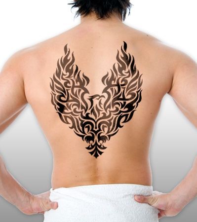 Black tribal phoenix tattoo on back for men