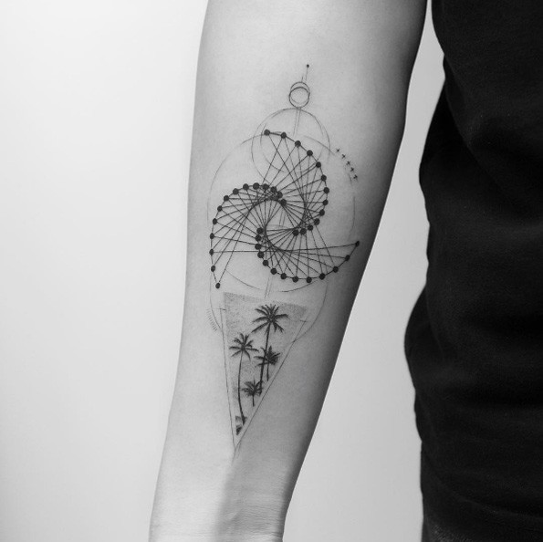 Black work style black ink forearm tattoo of vortex shaped ornaments combined with palm trees