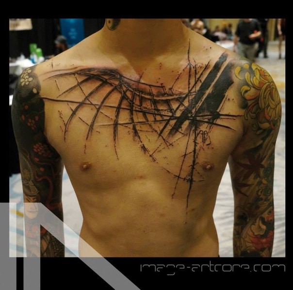 Blackwork style black ink chest tattoo of bird wing