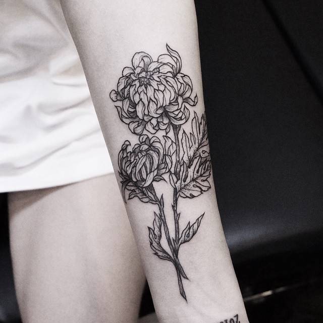 Blackwork style cool looking arm tattoo of chrysanthemum flower by Zihwa