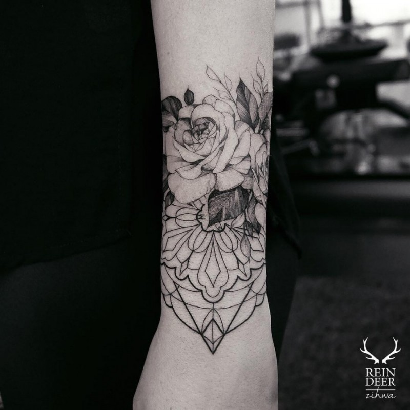 Blackwork style incredible looking arm tattoo of flowers by Zihwa