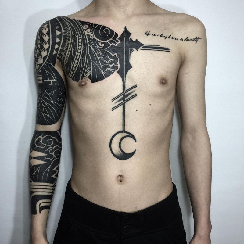 Blackwork style large sleeve and chest tattoo of various Polynesian ornaments
