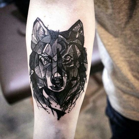 Blackwork style medium size forearm tattoo of wolf head
