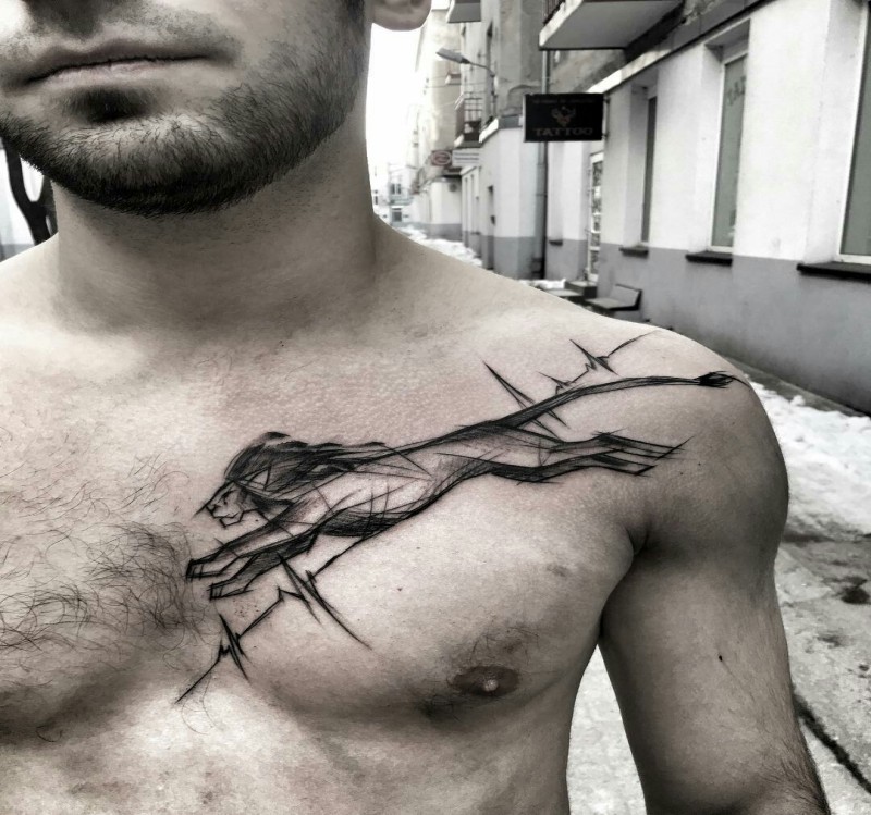 Blackwork style painted by Inez Janiak dramatic collarbone tattoo of running lion
