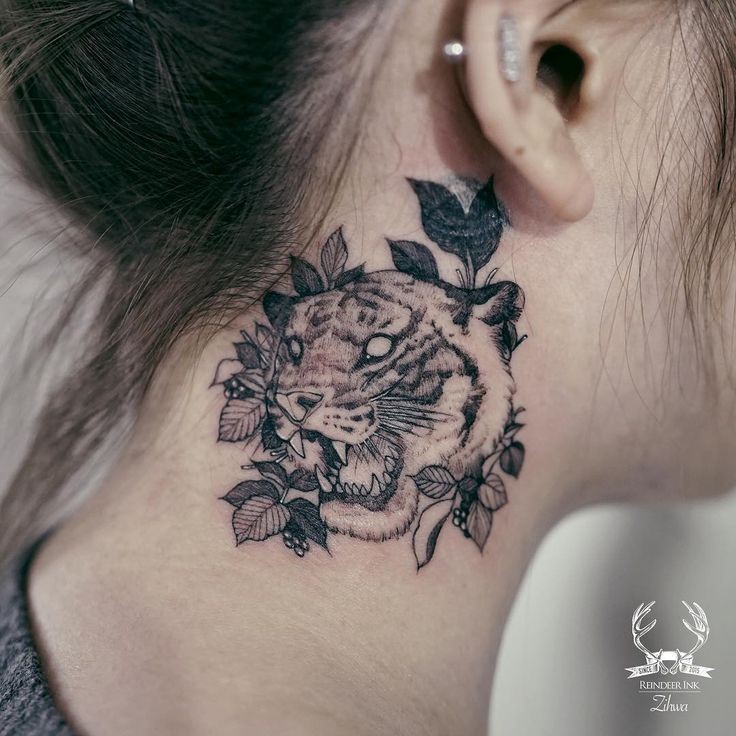 Blackwork style painted by Zihwa neck tattoo of leopard with leaves
