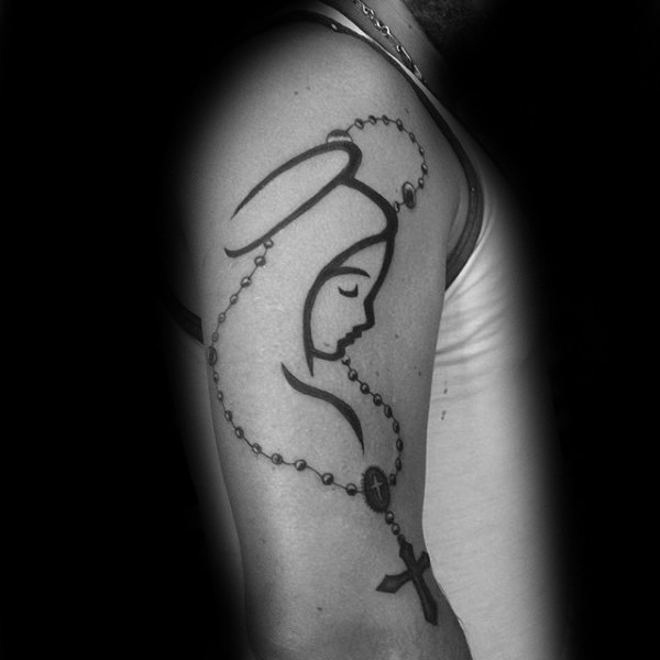 Blackwork style religious themed shoulder tattoo of woman with cross