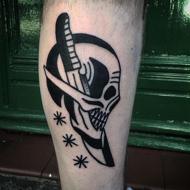 Blackwork style typical skull with knife and stars tattoo