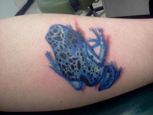 Blue frog tattoo on leg