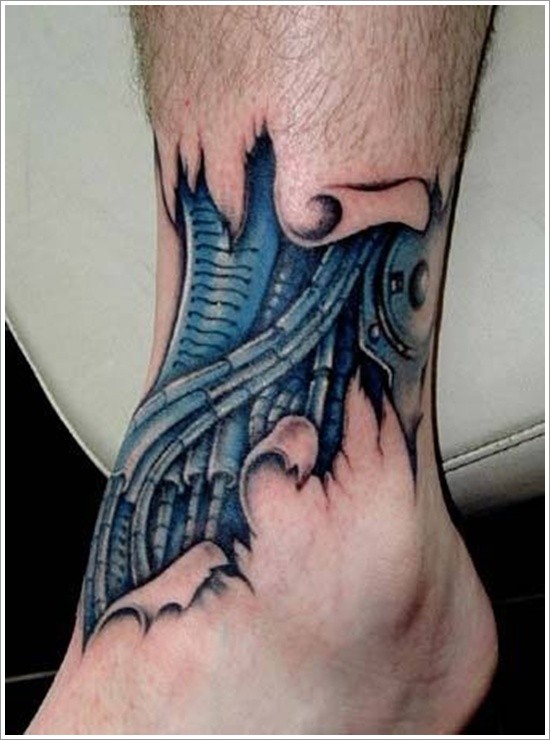 Blue mechanism under skin tattoo on leg