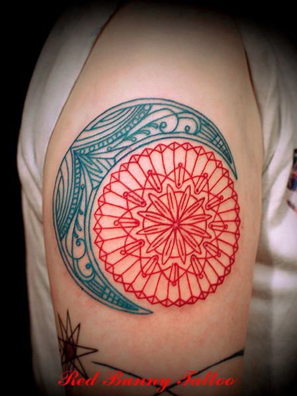 Blue red moon and sun mandala tattoo on shoulder