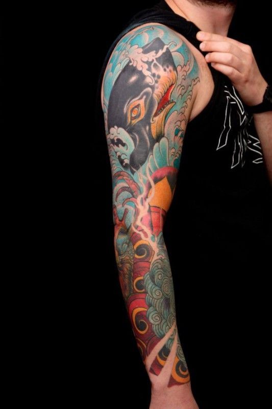 Blue whale tattoo on whole arm by Jimmy Duvall