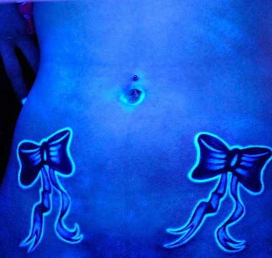 Bows on belly black light tattoo
