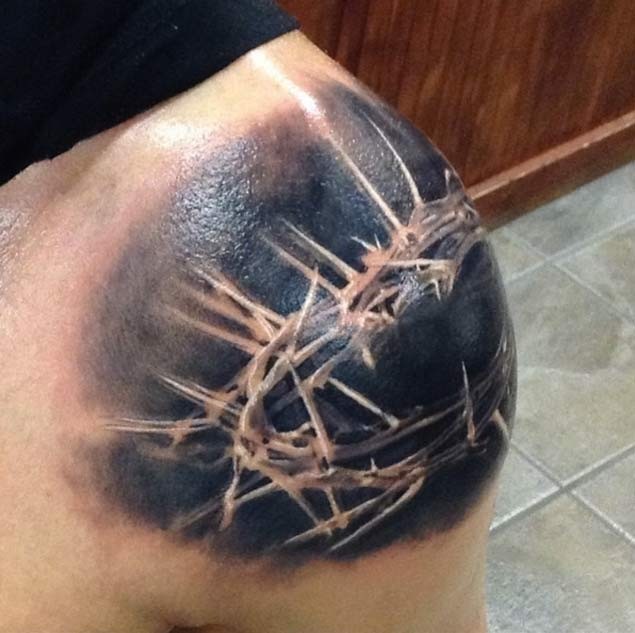 Breathtaking black and white Crown of thorns tattoo on shoulder
