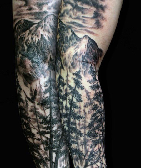 Breathtaking black and white mountain forest tattoo on sleeve
