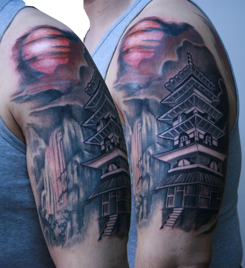 Breathtaking colored and detailed shoulder tattoo of Asian house in mountains