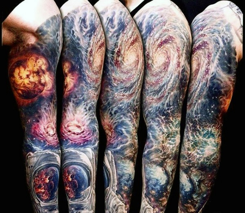 Breathtaking colored big deep space tattoo on sleeve