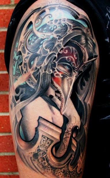 Breathtaking colored shoulder tattoo of woman with cool mask