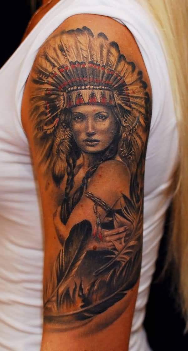 Breathtaking colored very detailed Indian woman portrait tattoo on shoulder with feather
