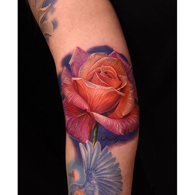 Breathtaking detailed arm tattoo of large rose with pigeon