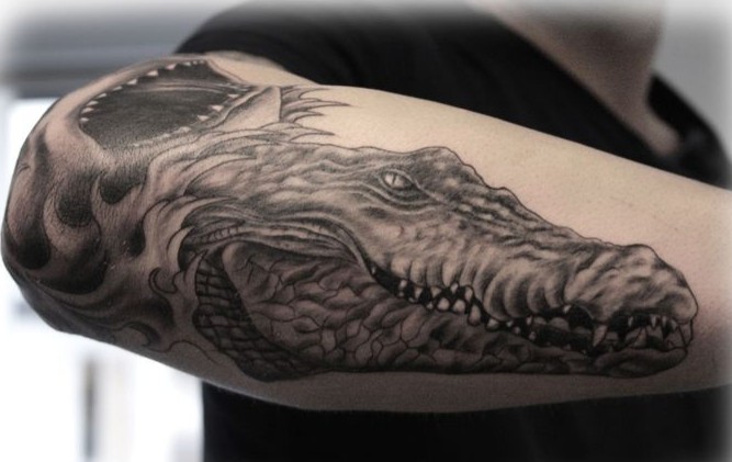 Breathtaking detailed big black ink alligator head tattoo on arm