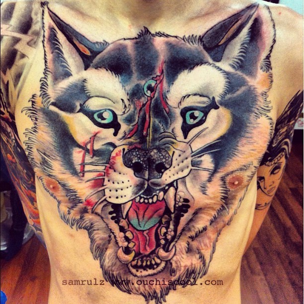 Breathtaking gorgeous looking colored chest tattoo of demonic wolf head