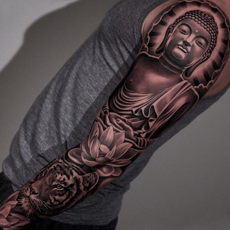 Breathtaking looking colored Buddha statue with lotus flower tattoo on sleeve combined with tiger