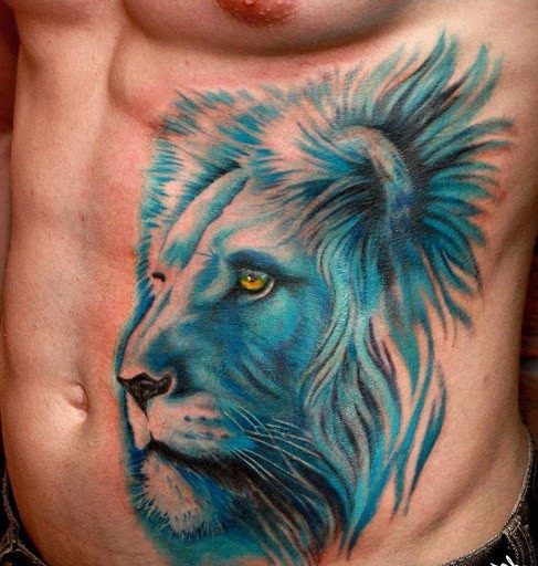 Breathtaking pale blue colored realistic detailed lion&quots head powerful tattoo on man&quots belly