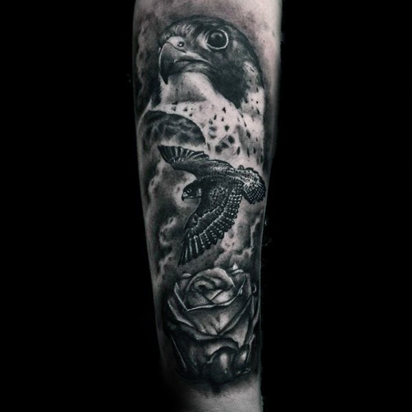 Breathtaking real photo like black and white detailed eagle with flower tattoo on arm