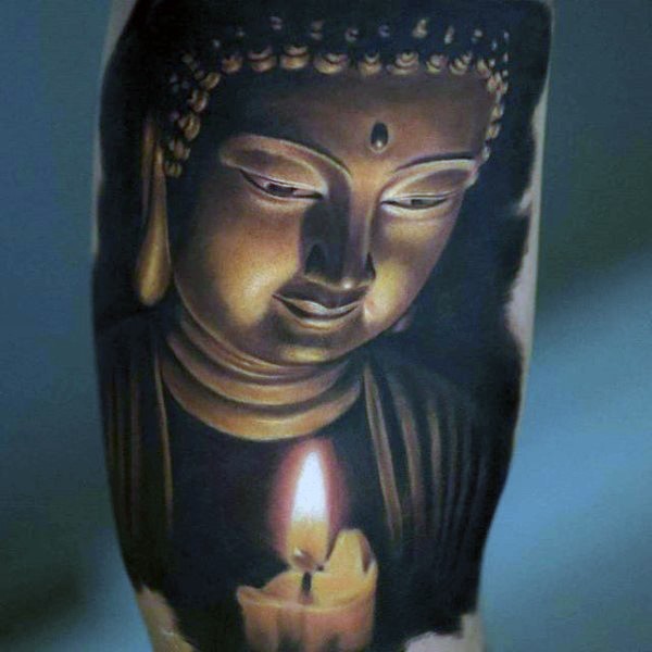 Breathtaking realism style colored biceps tattoo of Buddha statue and candle