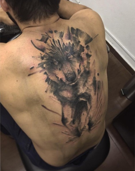 Breathtaking realistic looking whole back tattoo of large wolf